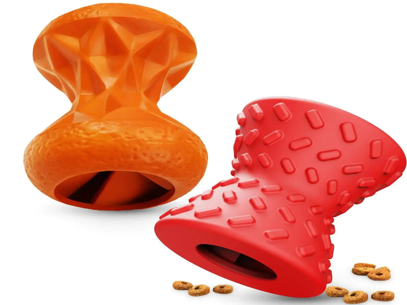 Orange and red dog toys with textured surfaces on a white background
